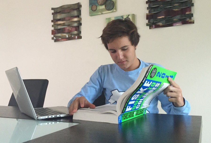 Senior Ivan Grela begins his college search by flipping through his copy of the Fiske Guide to Colleges.