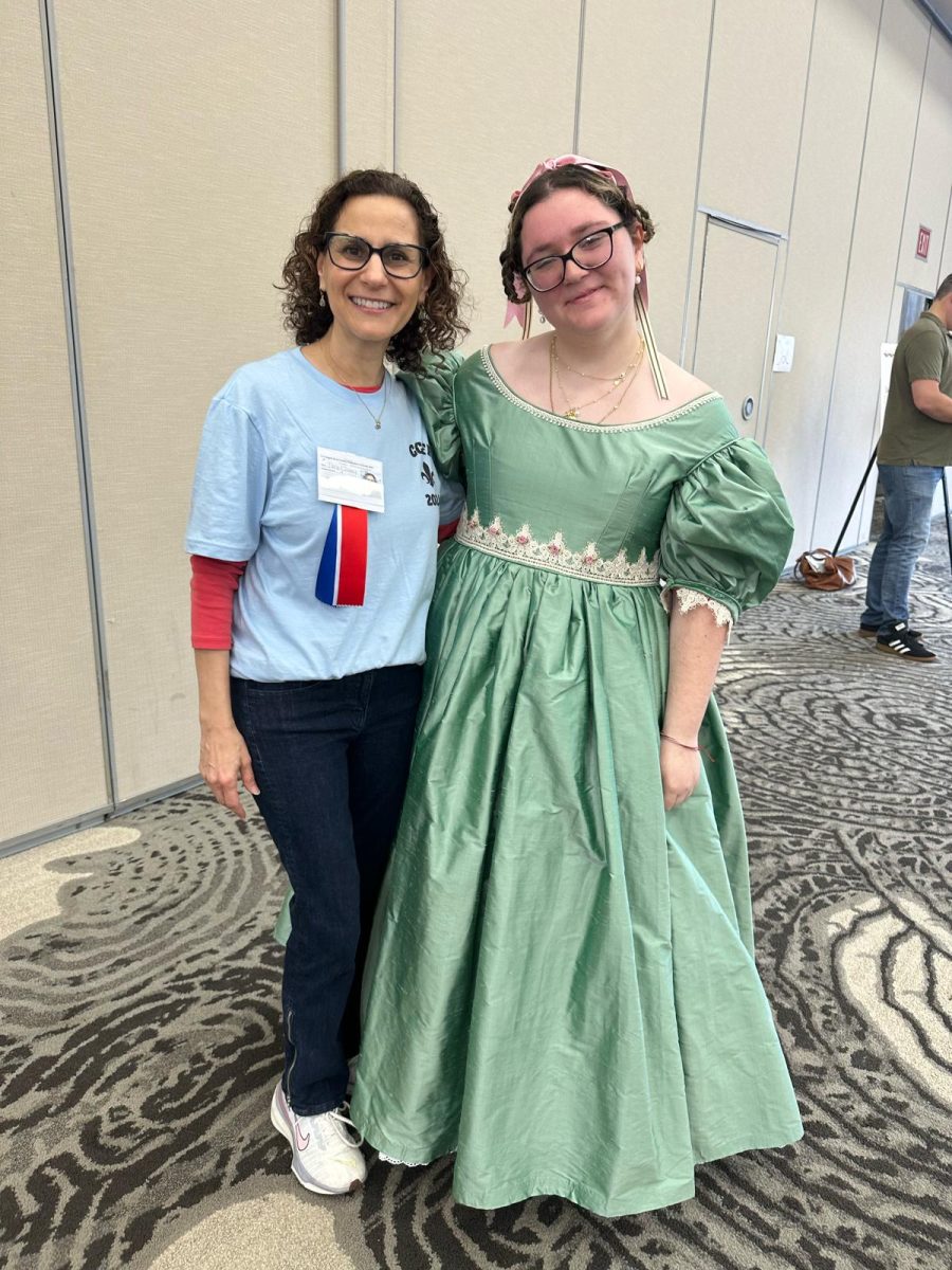 Hernandez stands with Dr. Tara Ellsley, President of Le Congrès, in her handmade gown. She would go on to win a remarkable Supérieur award, taking home first place for her poetry recital. 
