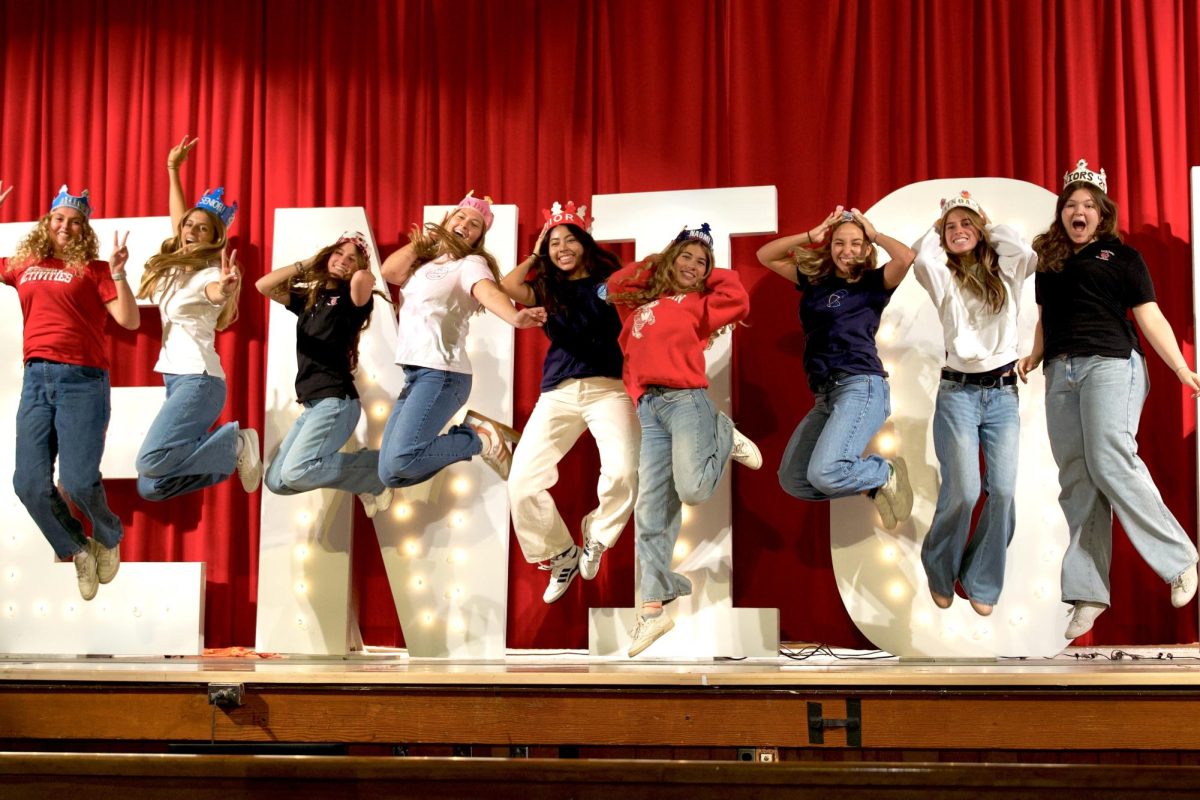 Seniors jump with excitement to celebrate the start of their last year of high school. 