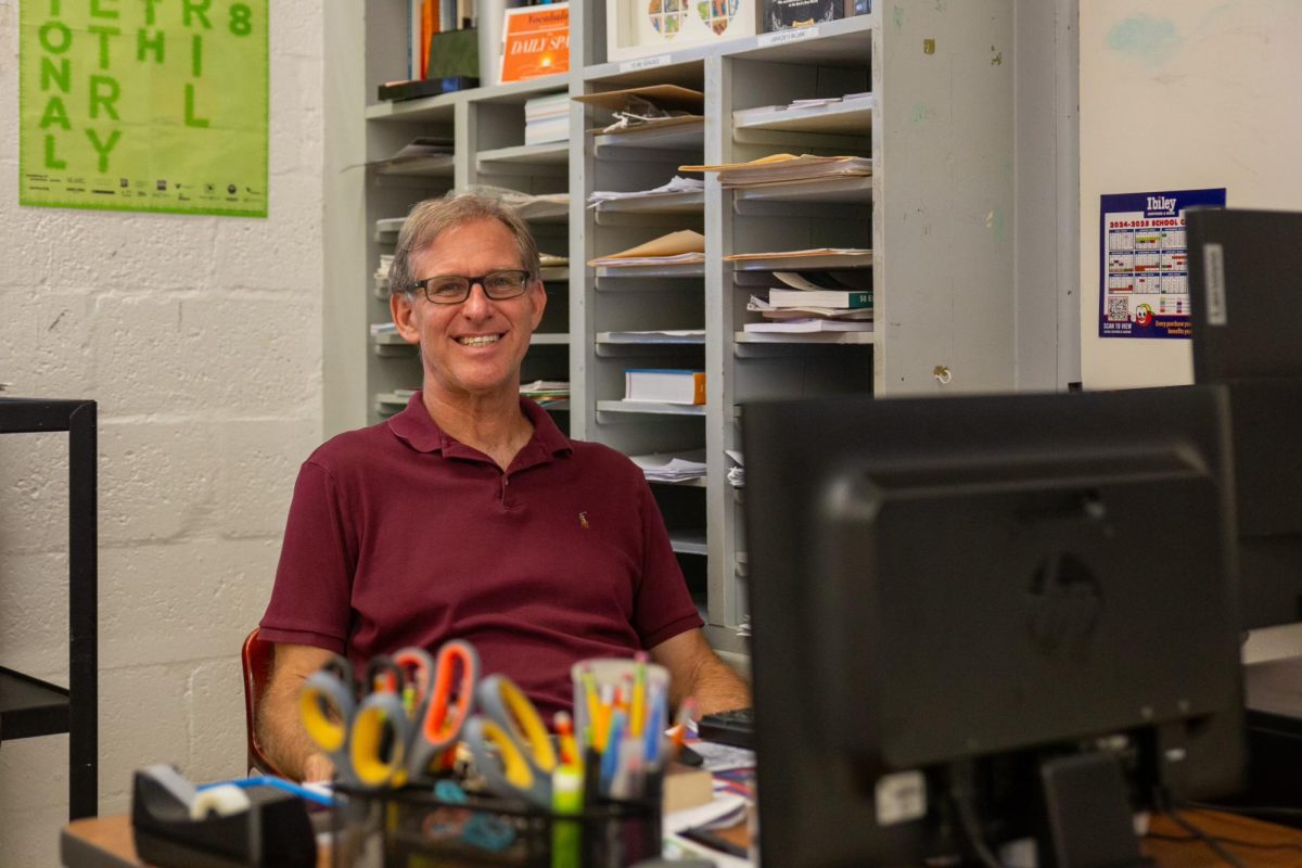 After settling into his new classroom, Mr. Hudson prepares to always greet his students with a smile.