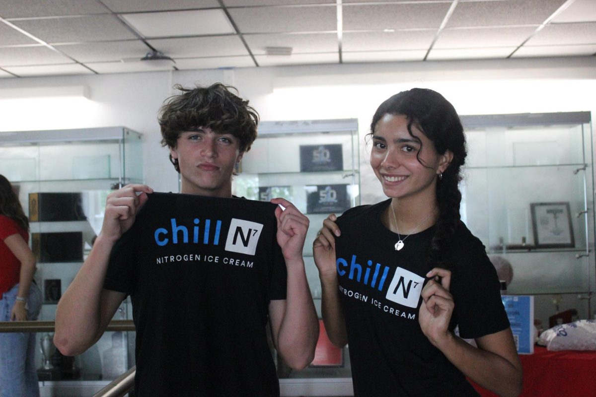 Juniors Cooper Piedra and Samantha Gonzalez flaunted their employee Chill-N shirts, representing the business at Gables.