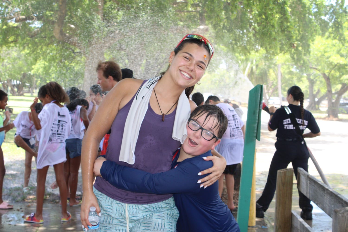 Melissa Sosa at the UM summer camp enjoying her time with one of her campers. 