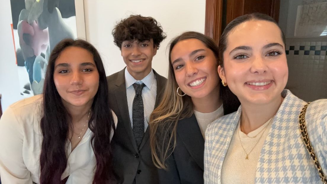 Tomas (second from left) came prepared with his fellow interns for the City of Coral Gables Commission Meeting on July 9, where he would deliver a layout on his team's findings and potential solutions. 