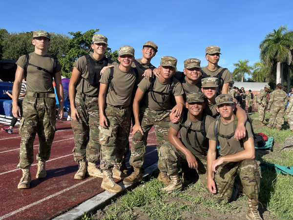 The Gables Raiders on our home field right after finishing their last event the rope bridge. They posed in excitement after their victory.