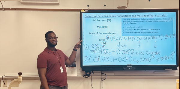 Mr. Michel teaches his students about the importance of Avogadro's number and moles in dimensional analysis. 