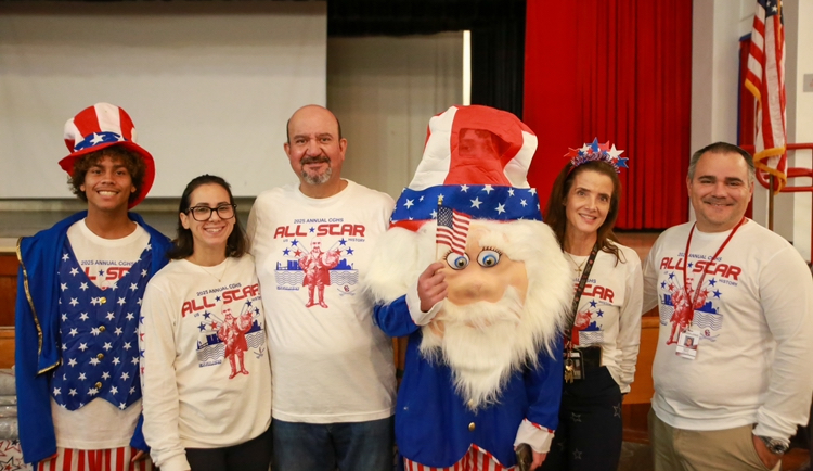 Teachers Mrs. Dalemberte, Mr. Diaz, and Mrs. Camacho including Principal Balboa join to commemorate every student's accomplishment. Alongside mascot, Uncle Sam, they are eager to be hosting another U.S. history celebration.