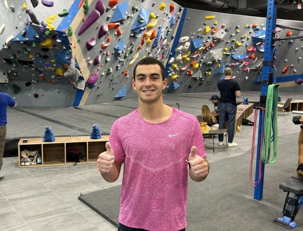 Covering his hands with chalk, senior Eduardo Solorzano prepares to attempt new climbs with hopes of competing in rock climbing at the collegiate level. 