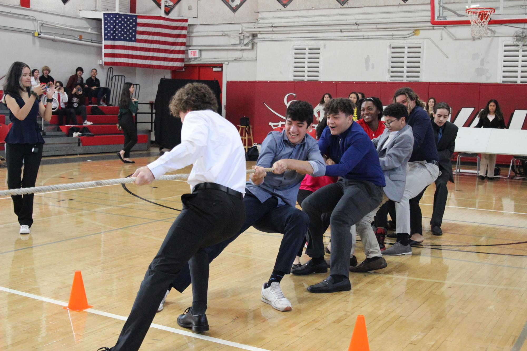 Ending the day on a high note, AOF freshman unwind with a game of tug of war after a long day of competition.