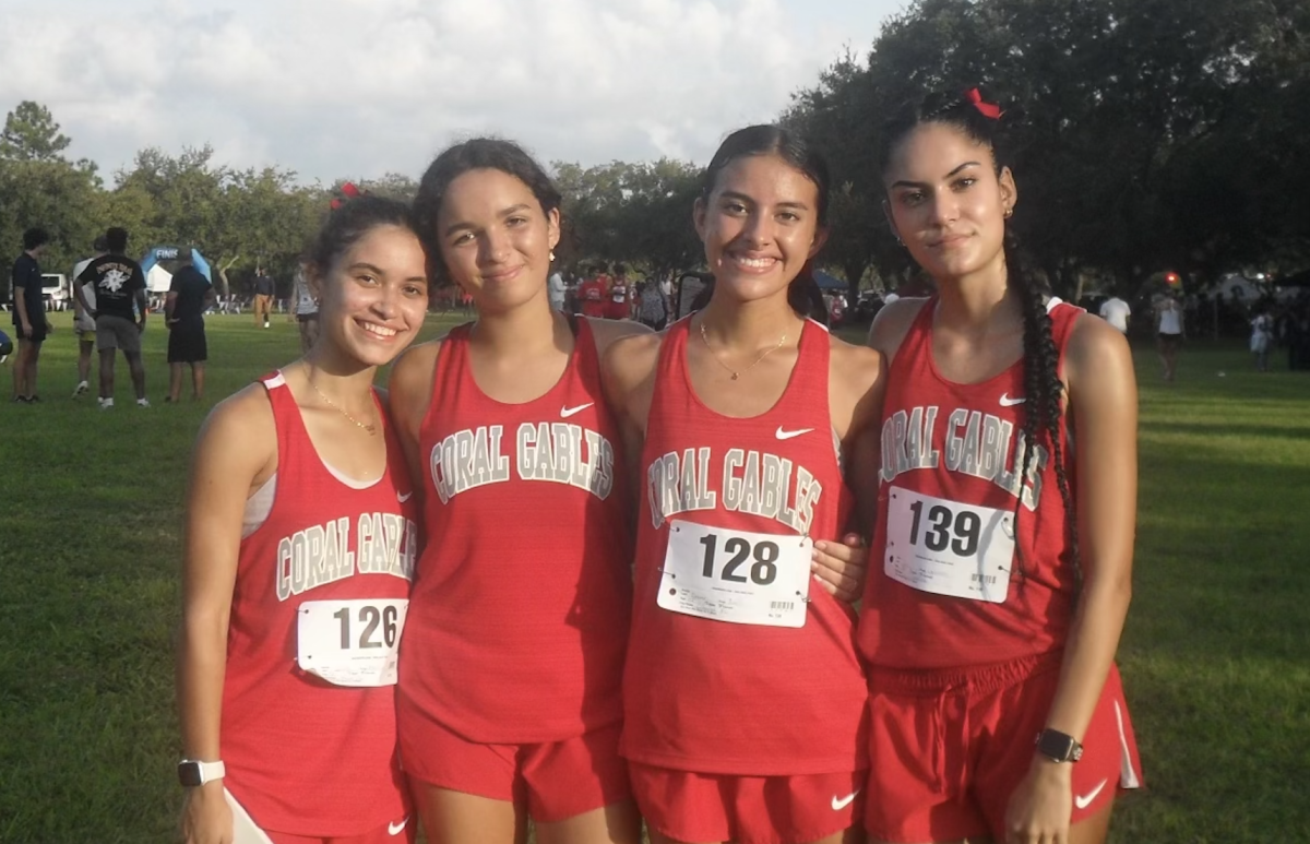 Donner poses with her teammates after running a cross country meet. The team has had an incredibly successful season this year.