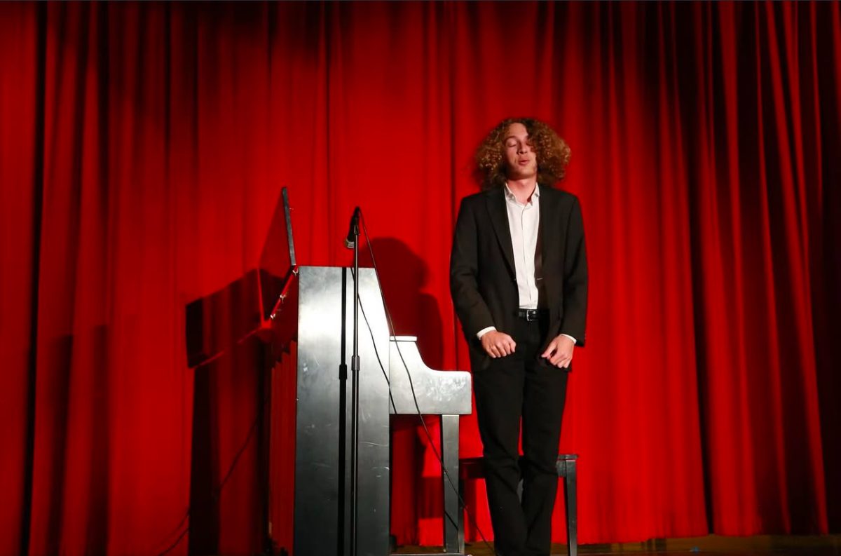 Galeazzi bows before the crowd at the Gables Christmas Concert. He performed a single and a duet with junior Aidan Remedios. 