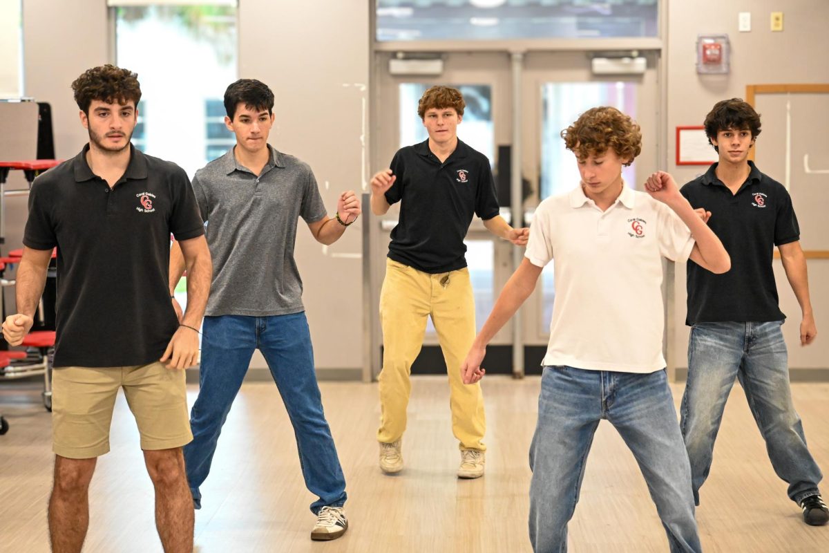 Seniors and Juniors alike prepare for the Mr. Coral Gables show by going over their dance moves. Students practice moving their hips and getting in rhythm with the beat.