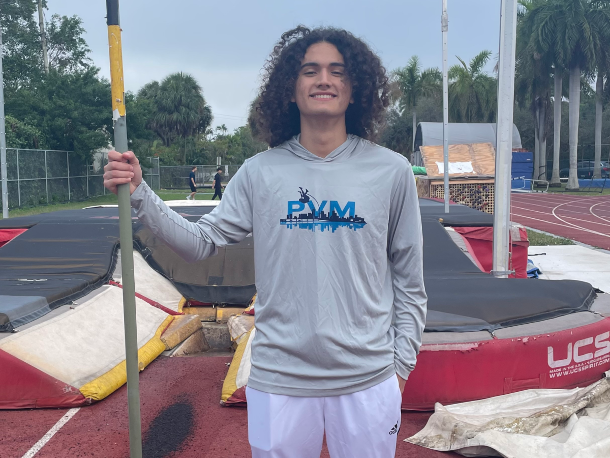 Senior Andrew Barragan prepares for an intense work out for pole vaulting. Holding his pole, he will be warming up for his practice and doing exercises to help him prepare for the 2025 track and field season.