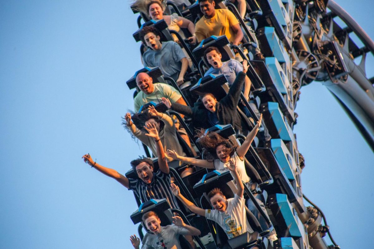 Class of 2025 seniors rush down Velocicoaster's 140-foot drop as they enjoy one of the many Islands of Adventure's attractions.