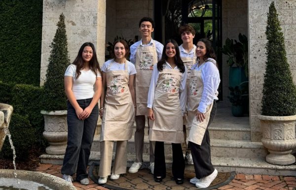 Student Activities members pose outside their respective houses eager to assist with preparations for Tour of Kitchens.